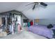 Slanted ceiling bedroom with comfortable carpet, ceiling fan, and storage rack at 100 Nighthawk Ln, Summerville, SC 29485