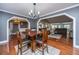 Open dining space features hardwood floors and views of the living room at 100 Nighthawk Ln, Summerville, SC 29485
