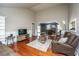 Cozy living room with hardwood floors, comfortable seating, and an open layout for easy entertaining at 100 Nighthawk Ln, Summerville, SC 29485