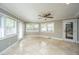 Bright sunroom with tile floors, ceiling fan, and multiple windows for natural light at 100 Nighthawk Ln, Summerville, SC 29485