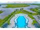 Aerial view showcasing large community pool, river access, docks, kayaking, and waterfront views with marsh at 100 Tidewater Way, Charleston, SC 29492
