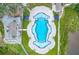 Overhead view of a uniquely shaped pool with cabanas and patio, set in a well-maintained outdoor recreation area at 100 Tidewater Way, Charleston, SC 29492