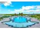 Resort-style pool with ample lounge chairs and umbrellas, overlooking the river and marsh in this community at 100 Tidewater Way, Charleston, SC 29492