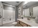 Well-lit bathroom with shower-tub combo, vanity, and stylish blue-and-white shower curtain at 1000 Winding Grove Ln, Moncks Corner, SC 29461