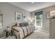 Cozy bedroom with comfortable bed, decorative pillows, and a window offering natural light at 1000 Winding Grove Ln, Moncks Corner, SC 29461