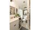 Bright bathroom with white vanity, decorative mirror, toilet, and glass shower, offering a fresh, inviting space at 1012 Ashley Ave, Charleston, SC 29403