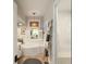 Bathroom with a soaking tub, ladder for towels, and a window with shutters providing natural light at 1012 Ashley Ave, Charleston, SC 29403