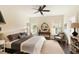 Well-lit bedroom with a plush bed, dark hardwood floors, and neutral décor at 1012 Ashley Ave, Charleston, SC 29403