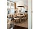 Elegant dining room with a large pendant light, a wooden table with seating for six, and bright windows at 1012 Ashley Ave, Charleston, SC 29403