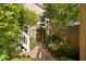 Charming front entrance with brick path and lush landscaping at 1012 Ashley Ave, Charleston, SC 29403