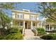 Charming two-story home with a welcoming front porch and manicured landscaping at 1012 Ashley Ave, Charleston, SC 29403