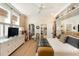 Bright main bedroom with a ceiling fan, large windows, walk-in closet, and carpet flooring at 1012 Ashley Ave, Charleston, SC 29403