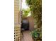 Outdoor grilling area featuring a black Weber grill, wooden deck, and fenced in for privacy and shade at 1012 Ashley Ave, Charleston, SC 29403
