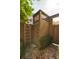 Enclosed outdoor shower area with wooden construction, ladder for towels, and brick flooring at 1012 Ashley Ave, Charleston, SC 29403