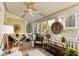 Spacious screened porch with ceiling fan offers a comfortable outdoor living area at 1012 Ashley Ave, Charleston, SC 29403