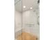 Modern shower with white subway tiles, a built-in seat, glass door, and chrome fixtures at 1012 Ashley Ave, Charleston, SC 29403