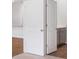 This is an image of a hallway with white doors, neutral walls, and neutral colored carpet at 1064 Forrest Creek Dr, Summerville, SC 29483