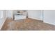 A spacious living room showcasing hardwood flooring, connecting seamlessly with the kitchen area, creating an open and airy atmosphere at 1064 Forrest Creek Dr, Summerville, SC 29483