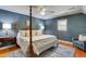 Bedroom with blue walls, four poster bed and hardwood floors at 1068 Witherbee Rd, Moncks Corner, SC 29461