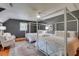 Bedroom features two canopy beds with floral bedding, sitting area at 1068 Witherbee Rd, Moncks Corner, SC 29461