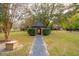 Scenic garden gazebo with brick accents, gravel pathway, surrounded by mature trees and landscaping at 1068 Witherbee Rd, Moncks Corner, SC 29461