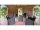 Cozy gazebo interior with comfortable seating arrangement, ideal for outdoor relaxation and entertaining at 1068 Witherbee Rd, Moncks Corner, SC 29461