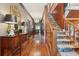 Inviting foyer with hardwood floors, staircase, rug and traditional decor at 1068 Witherbee Rd, Moncks Corner, SC 29461