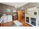 Large laundry room with sink, cabinetry, laundry machine and decorative art at 1068 Witherbee Rd, Moncks Corner, SC 29461