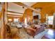A generous living room with wood paneling, fireplace and comfortable seating at 1068 Witherbee Rd, Moncks Corner, SC 29461
