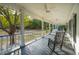 A relaxing outdoor porch featuring views of landscaped yard and mature trees at 1068 Witherbee Rd, Moncks Corner, SC 29461