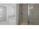Bathroom featuring a shower with a glass enclosure and a soaking tub at 114 Midmills Ln, Summerville, SC 29486