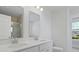Bright bathroom featuring a double sink vanity with modern faucets and quartz countertop at 114 Midmills Ln, Summerville, SC 29486