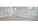 This bedroom has a neutral color palette, carpeted floors and white trim around the windows at 114 Midmills Ln, Summerville, SC 29486