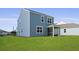 This home has a screened in porch and backyard with grass at 114 Midmills Ln, Summerville, SC 29486