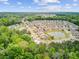 Wide aerial view of a community with serene ponds amid lush greenery, offering a blend of natural beauty at 1160 Old Field Dr, Summerville, SC 29483