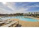Relax by the community pool on comfortable lounge chairs, enjoying the beautiful surroundings and resort-like amenities at 1160 Old Field Dr, Summerville, SC 29483