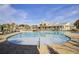 Spacious community pool featuring a splash pad area with ample seating and a meticulously maintained pool deck at 1160 Old Field Dr, Summerville, SC 29483