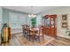 Elegant dining room with wood table, chairs, a china cabinet, and a bay window providing ample natural light at 1160 Old Field Dr, Summerville, SC 29483