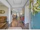 Inviting entryway with hardwood floors, trey ceiling, and view of the living spaces beyond at 1160 Old Field Dr, Summerville, SC 29483