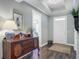 Warm foyer featuring hardwood floors, elegant decor, and a glimpse into the home's inviting interior at 1160 Old Field Dr, Summerville, SC 29483