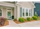 Close-up of front door and entry showcasing landscaping and architectural details at 1160 Old Field Dr, Summerville, SC 29483
