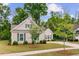 Beautifully landscaped home with lush lawn, mature trees, and a welcoming walkway to the front door at 1160 Old Field Dr, Summerville, SC 29483