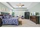 Spacious main bedroom with a tray ceiling, plantation shutters, ceiling fan, and ample natural light at 1160 Old Field Dr, Summerville, SC 29483