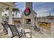 Outdoor fireplace with cozy seating, ideal for gathering and enjoying cool evenings at 1160 Old Field Dr, Summerville, SC 29483