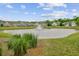 Scenic pond view with a fountain in a well-maintained community, enhancing its visual appeal at 1160 Old Field Dr, Summerville, SC 29483