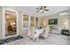 Enclosed sunroom with dining set and cozy seating area, perfect for relaxation and entertaining at 1160 Old Field Dr, Summerville, SC 29483
