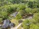 Aerial view of the property showcasing the home, pool, and surrounding lush greenery and neighborhood at 118 Elery Ter, Summerville, SC 29485