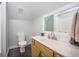 Bathroom with a wood vanity, black tiled floors, and a shower-tub combo at 118 Elery Ter, Summerville, SC 29485