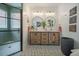 Modern bathroom features a dual vanity with round mirrors and a glass-enclosed shower at 118 Elery Ter, Summerville, SC 29485