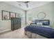 Comfortable bedroom with a cozy bed, dark wood dresser, and artwork at 118 Elery Ter, Summerville, SC 29485